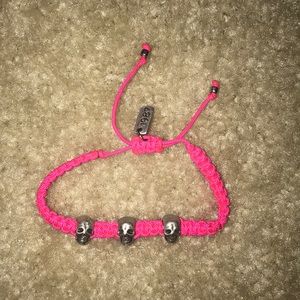 Pink skull bracelet.